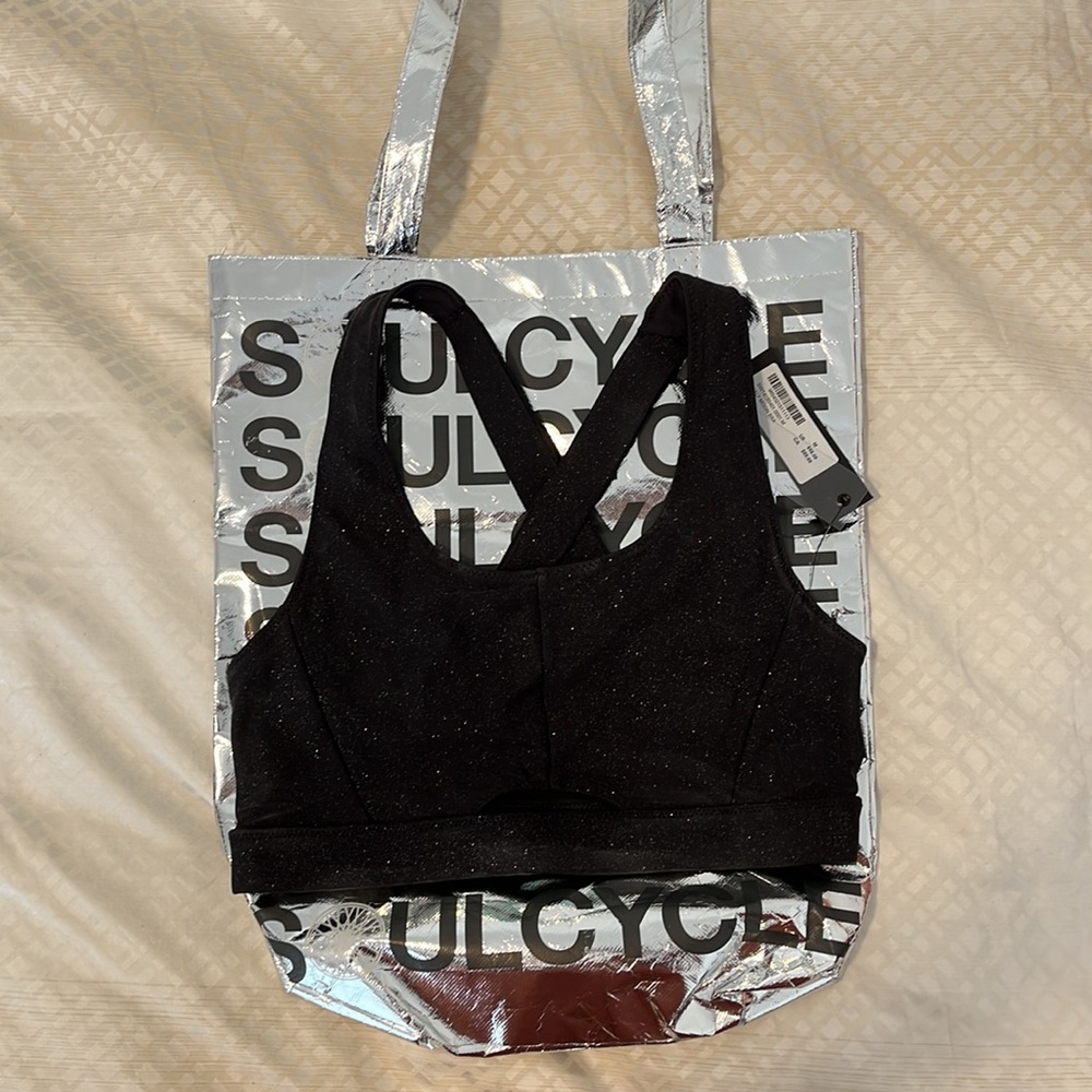 Black glitter Soul Cycle half moon sports bra with silver SC bag
